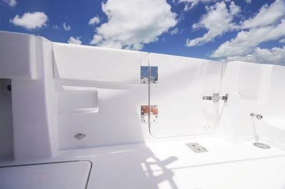 Slide: The Image of 2023 Fountain 38 Tournament Edition boat deck under clear blue sky. - 6