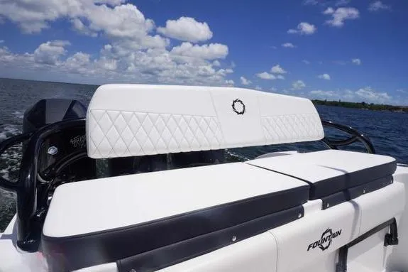 Slide: The Image of 2023 Fountain 38 Tournament Edition boat with white seating, ocean backdrop, and blue sky. - 7