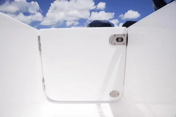 Slide: The Image of 2023 Fountain 38 Tournament Edition boat hatch under a bright blue sky with clouds. - 8