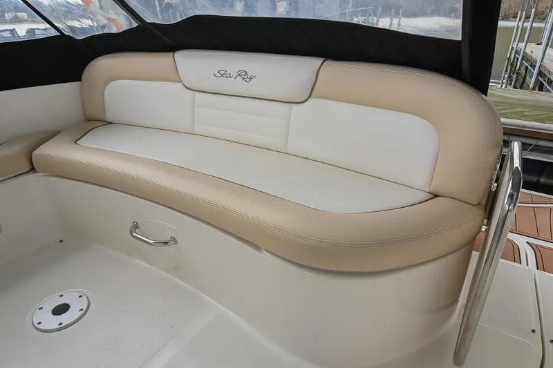 Slide: The Image of 2012 Sea Ray Sundancer 330 boat interior with beige and white seating. - 12