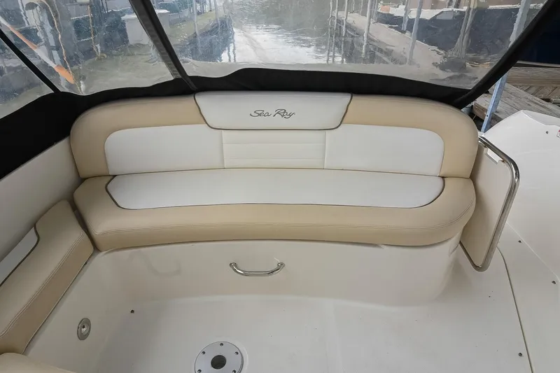 Slide: The Image of 2012 Sea Ray Sundancer 330 interior seating with beige and white upholstery. - 13