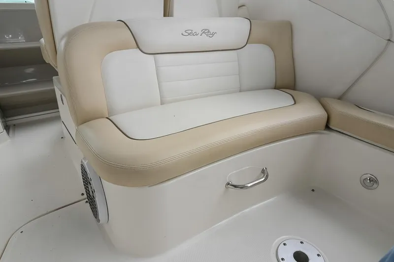 Slide: The Image of 2012 Sea Ray Sundancer 330 beige and white cushioned seating. - 14
