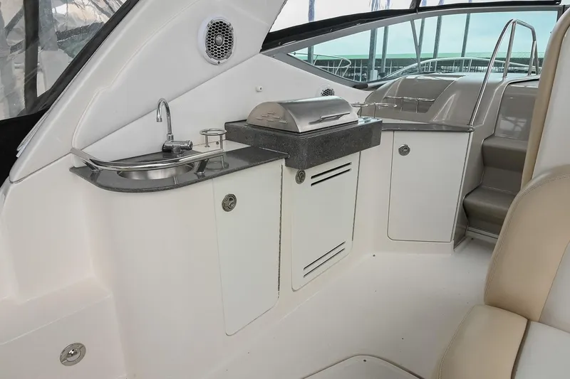 Slide: The Image of Outdoor kitchenette on a 2012 Sea Ray Sundancer 330 yacht with sink and grill. - 16