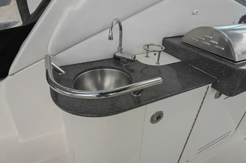 Slide: The Image of Outdoor grill and sink on 2012 Sea Ray Sundancer 330 yacht deck. - 18