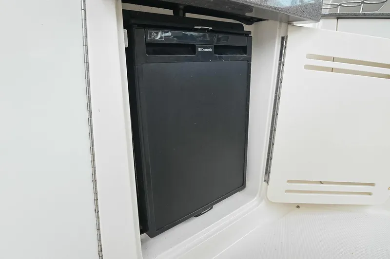 Slide: The Image of Interior view of 2012 Sea Ray Sundancer 330 yacht with seating and helm. - 20