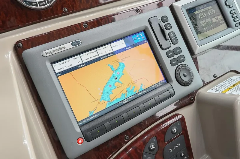 Slide: The Image of Dashboard of 2012 Sea Ray Sundancer 330 with navigation and control instruments. - 27