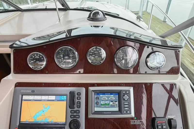 Slide: The Image of Luxurious seating on 2012 Sea Ray Sundancer 330 boat, featuring beige and white upholstery. - 28