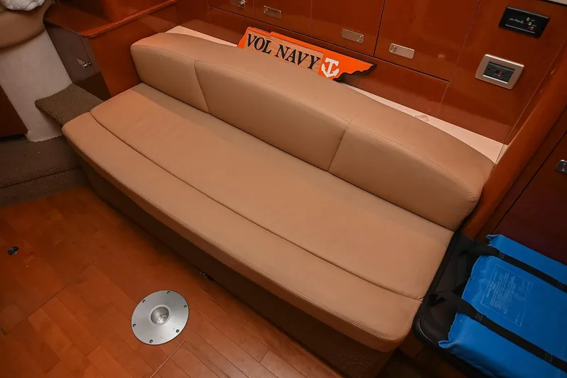 Slide: The Image of Interior of 2012 Sea Ray Sundancer 330 yacht with wooden cabinetry and seating. - 31