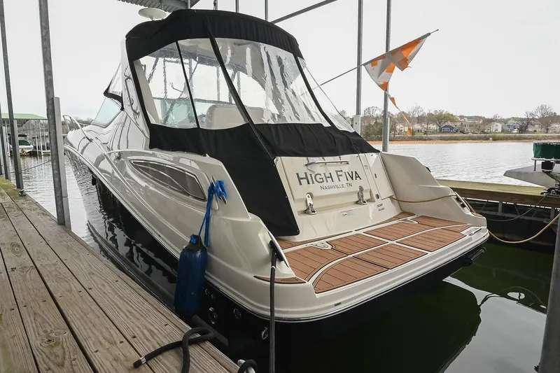 Slide: The Image of 2012 Sea Ray Sundancer 330 docked in a covered marina. - 4