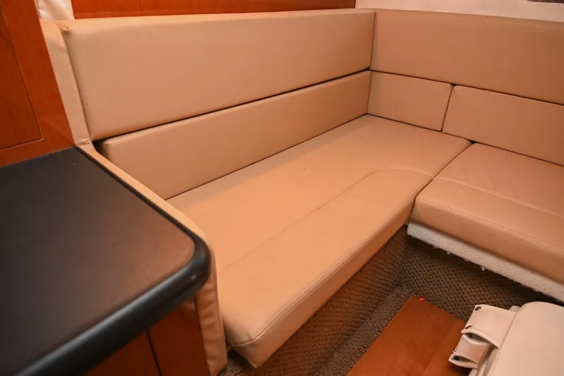Slide: The Image of Luxurious interior of 2012 Sea Ray Sundancer 330 with beige seating and modern amenities. - 47