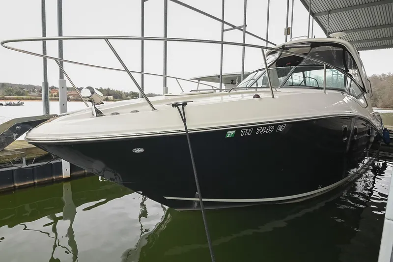 Slide: The Image of 2012 Sea Ray Sundancer 330 boat side view with logo and model name. - 5