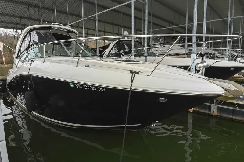 The Image of 2012 Sea Ray Sundancer 330 docked in a covered marina. - 0