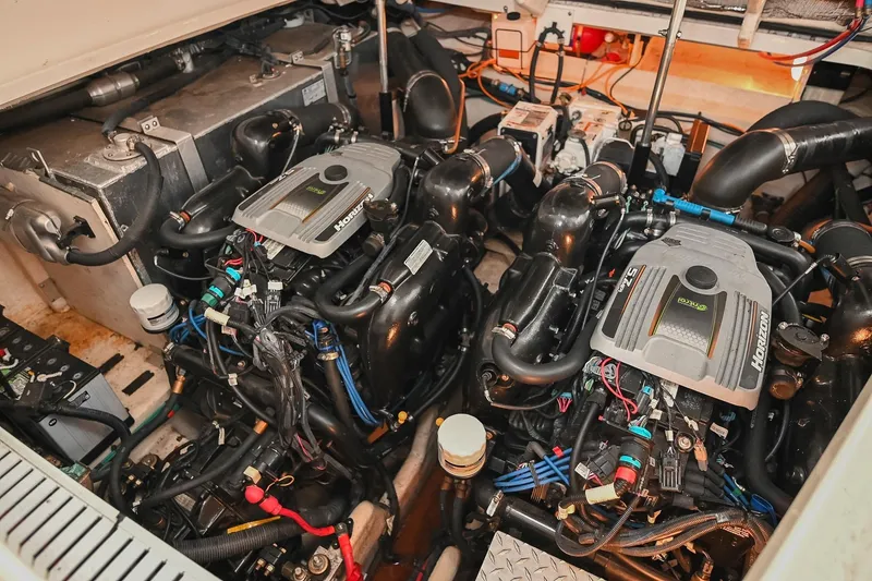 Slide: The Image of Engine room of a 2012 Sea Ray Sundancer 330, featuring a Horizon engine. - 54