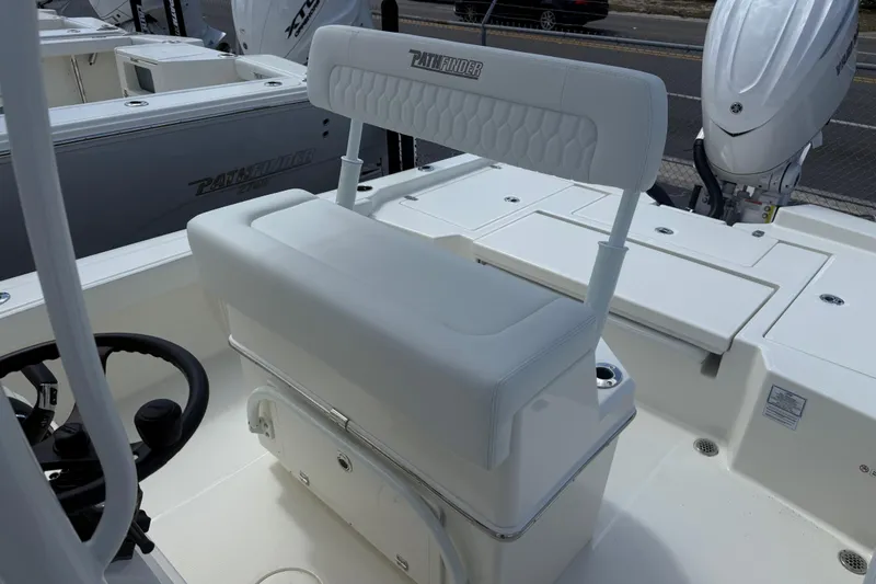 Slide: The Image of 2026 Pathfinder 2600 TRS boat interior with seating and steering wheel. - 10