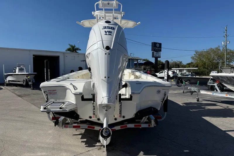 Slide: The Image of 2026 Pathfinder 2600 TRS boat with powerful 350 V6 engine, displayed outdoors. - 4