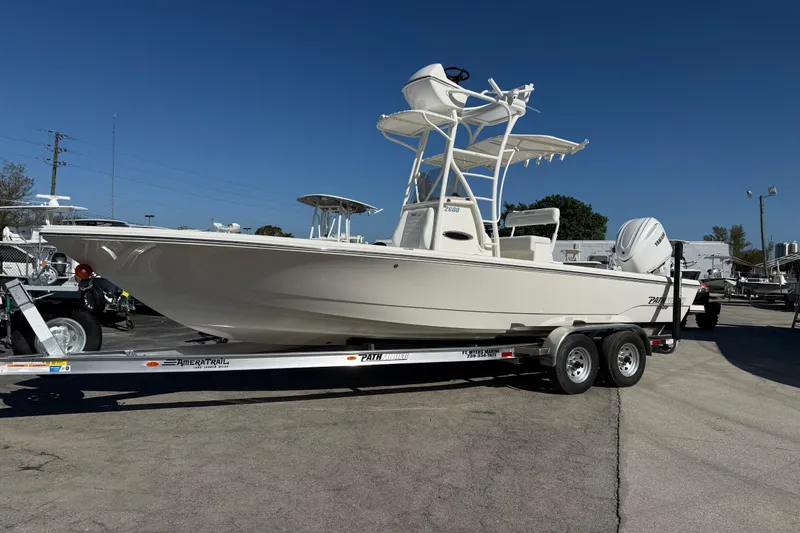 Slide: The Image of 2026 Pathfinder 2600 TRS boat on trailer under clear blue sky. - 6