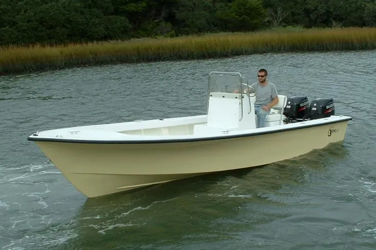 Slide: The Image of Manufacturer Provided Image: 2026 C-Hawk 23 Center Console boat cruising on a calm waterway. - 3