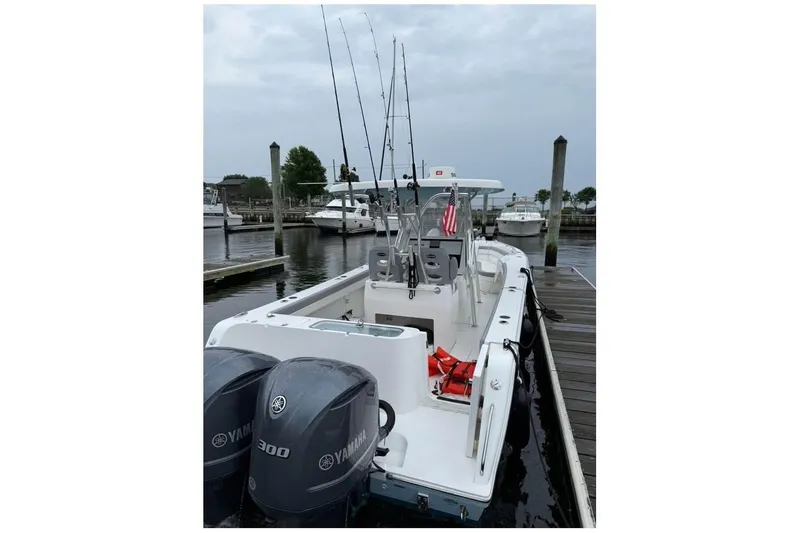 Slide: The Image of 2020 Release 301 RX boat with Yamaha engines docked. - 3