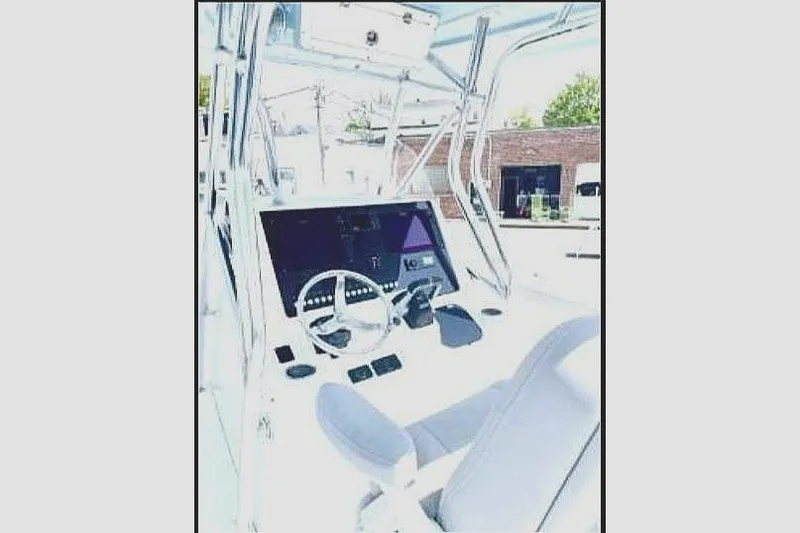 Slide: The Image of Interior view of a 2020 Release 301 RX boat cockpit. - 8