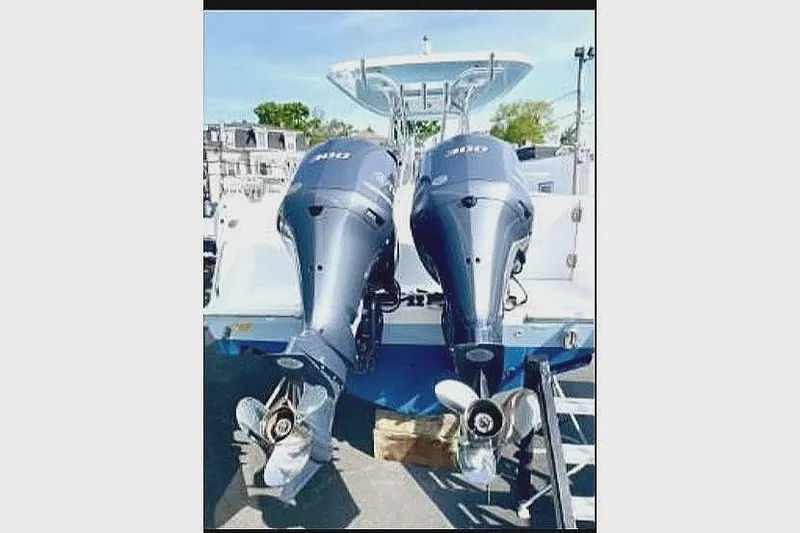 Slide: The Image of Two outboard motors on a 2020 Release 301 RX boat. - 9