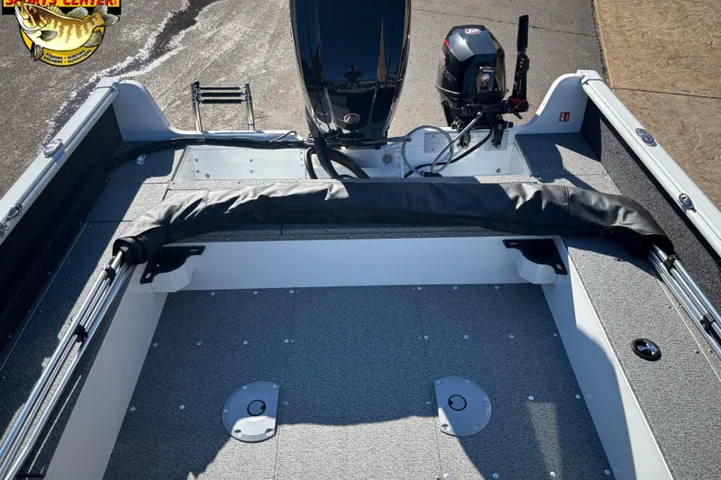 Slide: The Image of 2026 Lund 1800 Explorer Sport boat interior with motor and fishing equipment. - 4