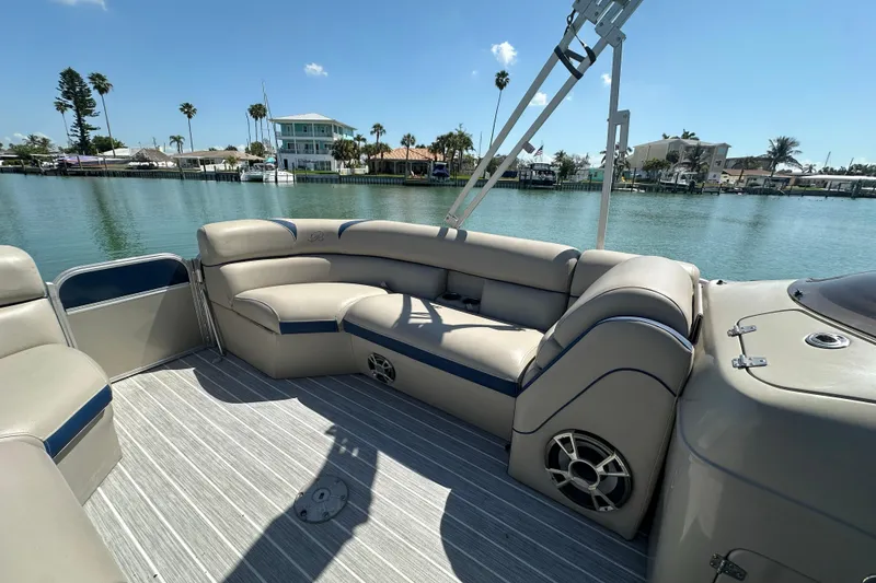 Slide: The Image of 2015 Berkshire 250E Premium pontoon boat interior with waterfront view. - 11