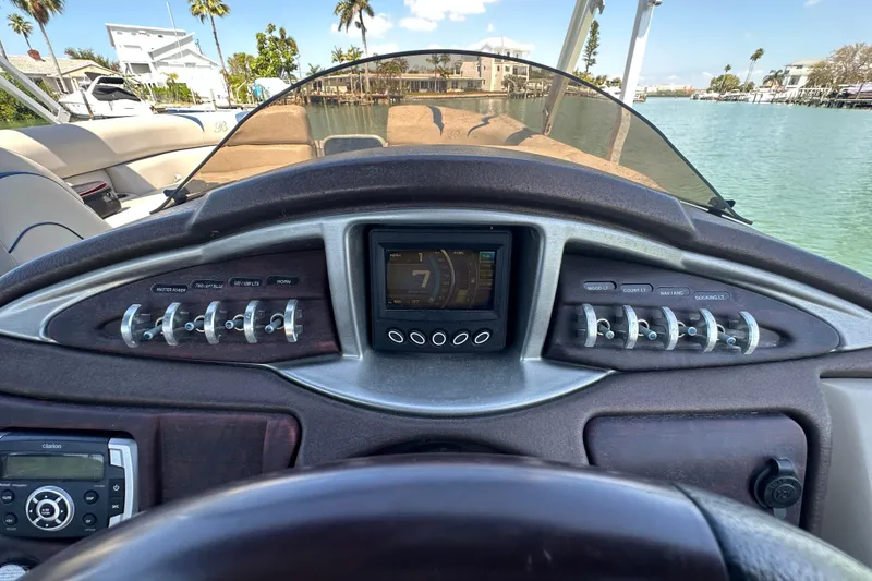 Slide: The Image of Dashboard of a 2015 Berkshire 250E Premium boat with control panel and display. - 17
