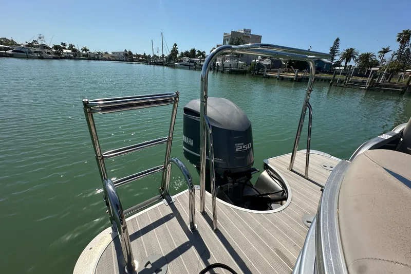 Slide: The Image of Berkshire 250E Premium 2015 boat with Yamaha 250 engine, docked in a marina. - 26