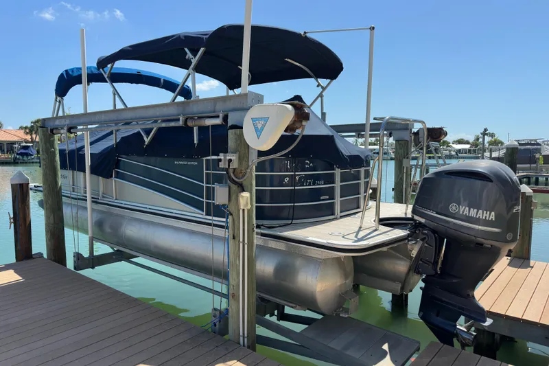 Slide: The Image of Berkshire 250E Premium 2015 pontoon boat with Yamaha motor on dock. - 6