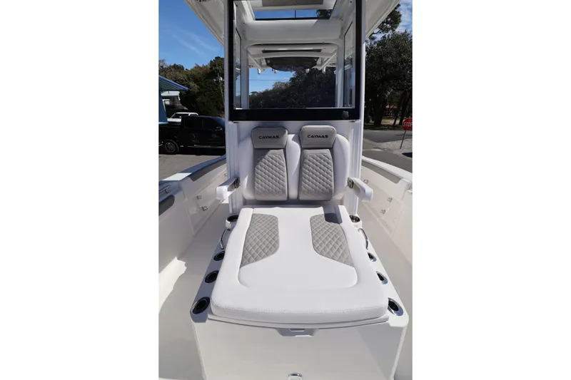 Slide: The Image of 2026 Caymas 291 boat interior with cushioned seating and modern design. - 23
