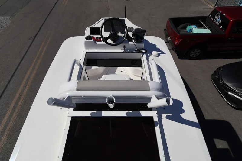Slide: The Image of Top view of 2026 Caymas 291 boat with steering wheel and seating area. - 27