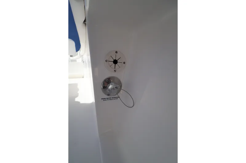 Slide: The Image of 2026 Caymas 291 boat detail showing fresh water washdown outlet. - 40