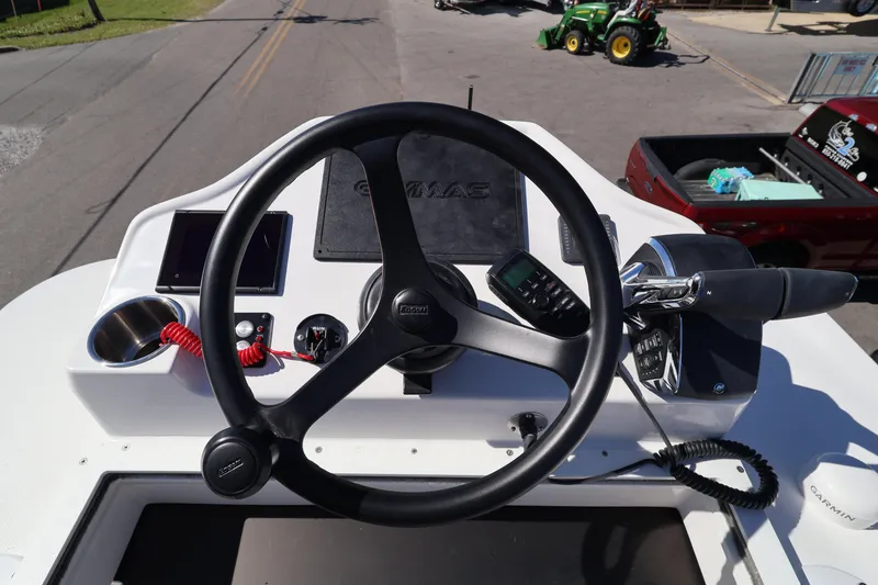 Slide: The Image of Steering console of 2026 Caymas 291 boat with controls and navigation equipment. - 44