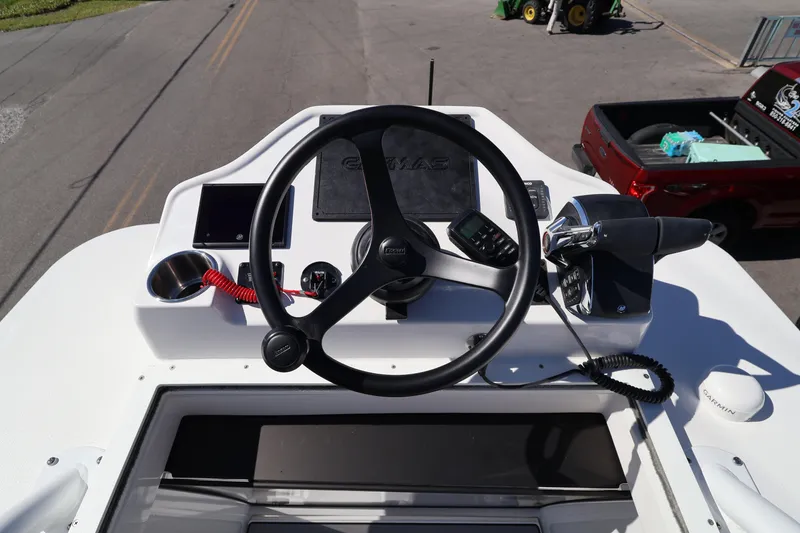 Slide: The Image of 2026 Caymas 291 boat dashboard with steering wheel and control panel. - 46