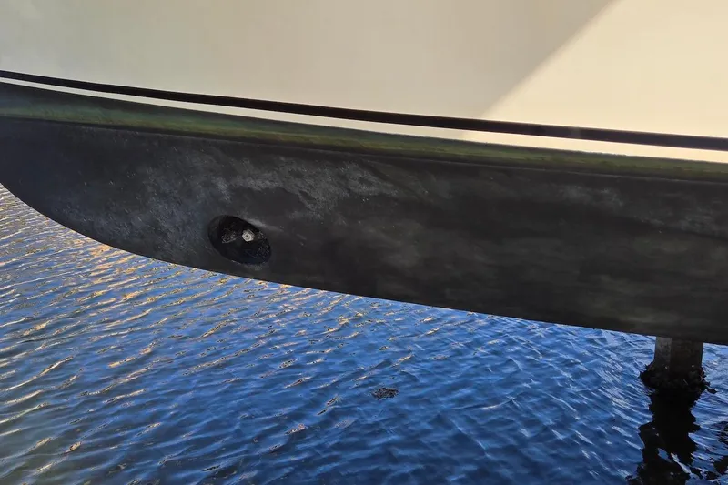 Slide: The Image of Hull of 2005 Camano 31 Troll boat above water, showing propeller opening. - 10