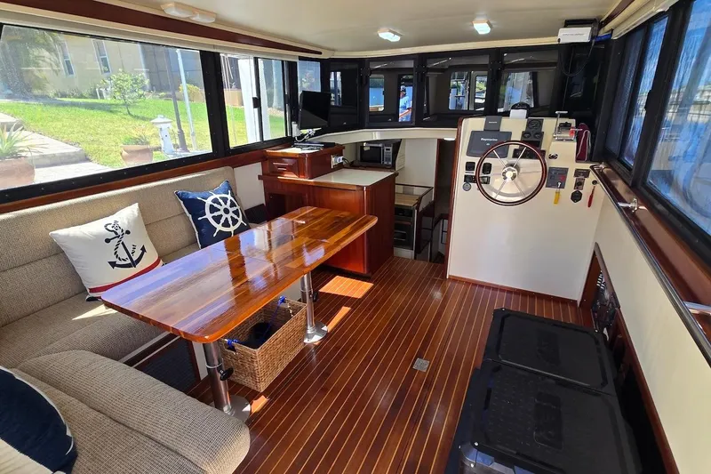 Slide: The Image of Interior of 2005 Camano 31 Troll boat with wooden table and nautical decor. - 18