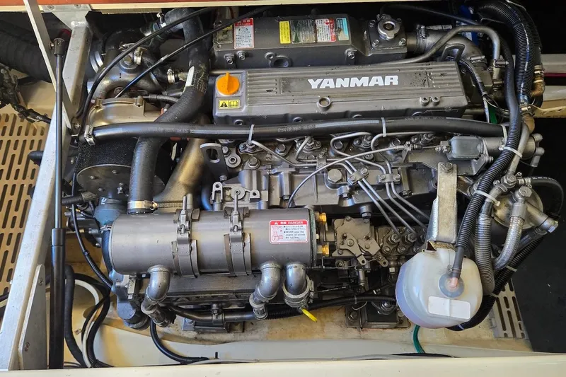Slide: The Image of Engine of a 2005 Camano 31 Troll boat, featuring a Yanmar diesel engine. - 28