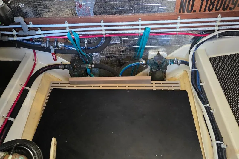 Slide: The Image of Engine compartment of 2005 Camano 31 Troll boat with visible wiring and components. - 31