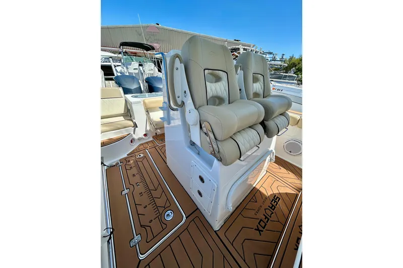 Slide: The Image of 2017 Seafox 288 Commander boat interior with dual seats and teak-style flooring. - 10