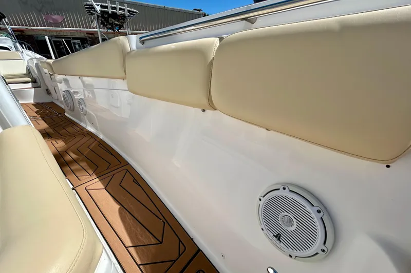 Slide: The Image of 2017 Seafox 288 Commander boat interior with cushioned seating and marine speakers. - 13