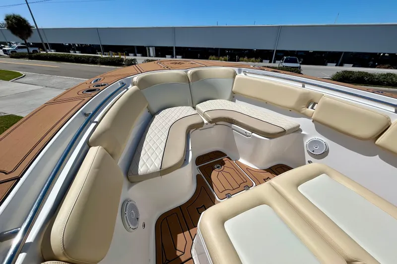 Slide: The Image of 2017 Seafox 288 Commander boat interior with beige seating and wood accents. - 16