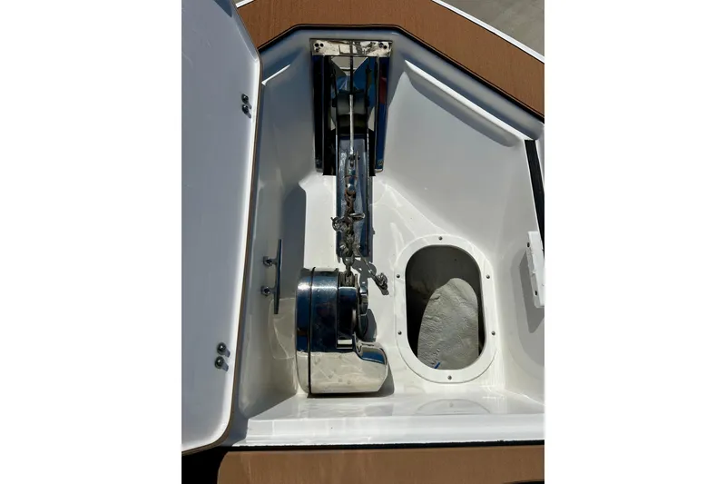 Slide: The Image of Anchor compartment of 2017 Seafox 288 Commander boat, featuring a stainless steel anchor system. - 24