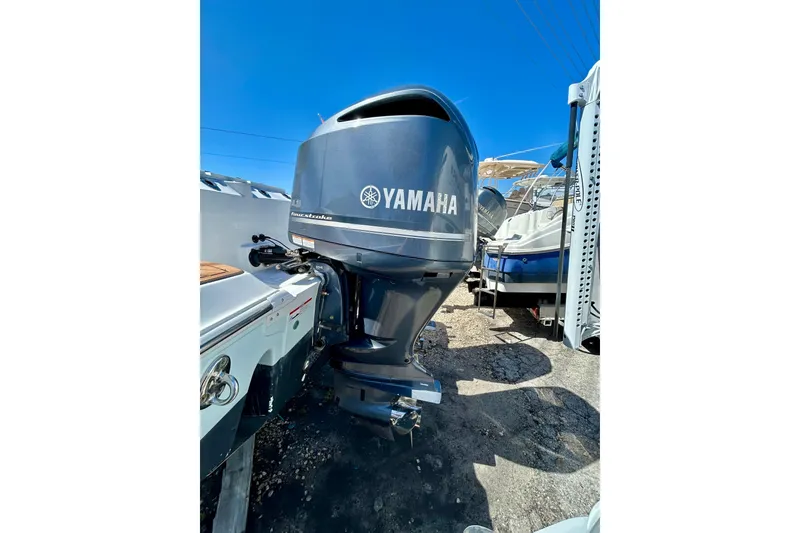 Slide: The Image of 2017 Seafox 288 Commander with Yamaha outboard motor in a sunny marina setting. - 26