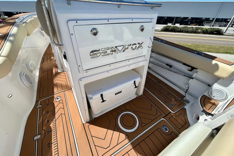 Slide: The Image of 2017 Seafox 288 Commander boat interior with teak flooring and storage compartment. - 7