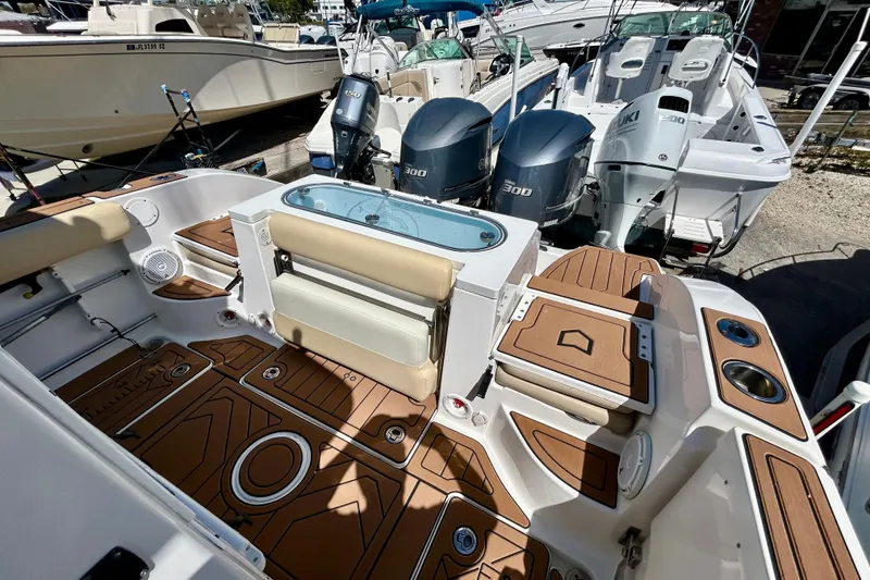 Slide: The Image of 2017 Seafox 288 Commander boat interior with dual 300 horsepower engines, featuring teak flooring. - 8