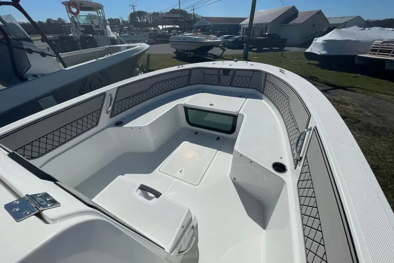 Slide: The Image of 2022 Wellcraft 202 Fisherman boat interior with spacious seating and storage compartments. - 1