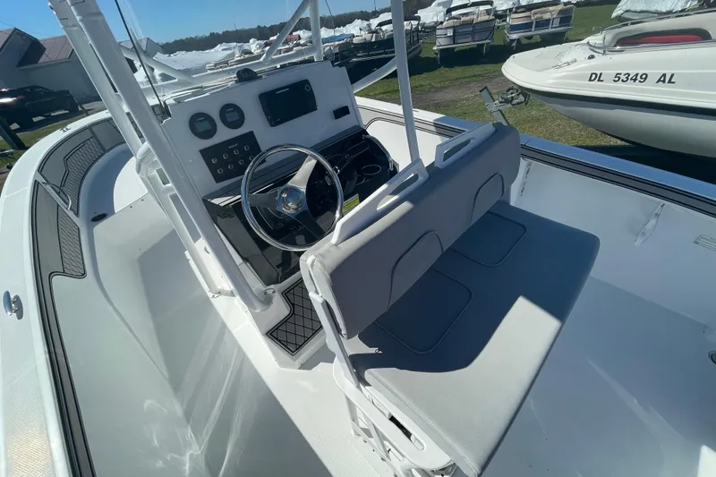 Slide: The Image of 2022 Wellcraft 202 Fisherman boat interior with steering console and seating. - 15
