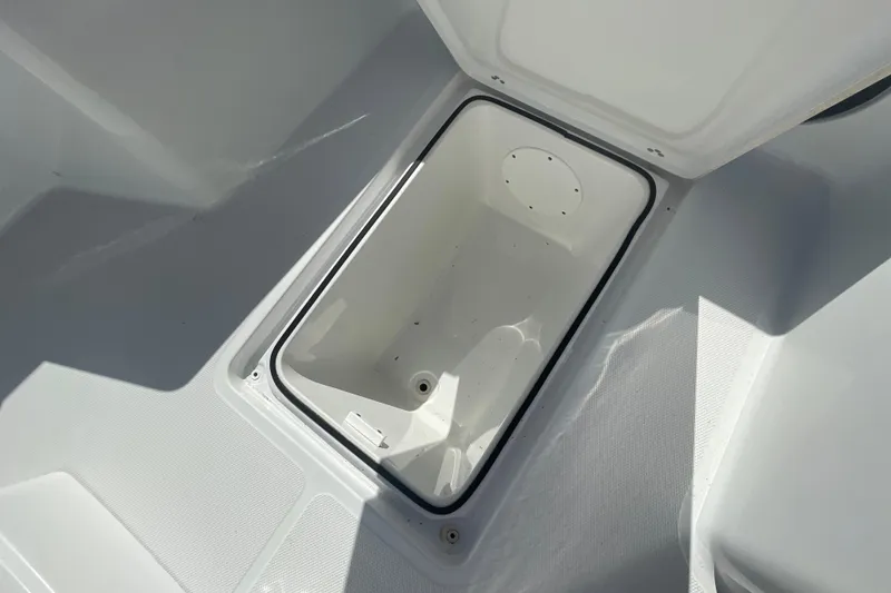 Slide: The Image of Open storage compartment on 2022 Wellcraft 202 Fisherman boat, showcasing interior space. - 4