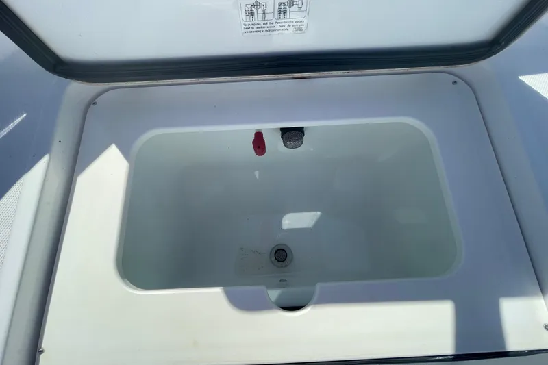 Slide: The Image of Livewell compartment in 2022 Wellcraft 202 Fisherman boat, open lid view. - 5