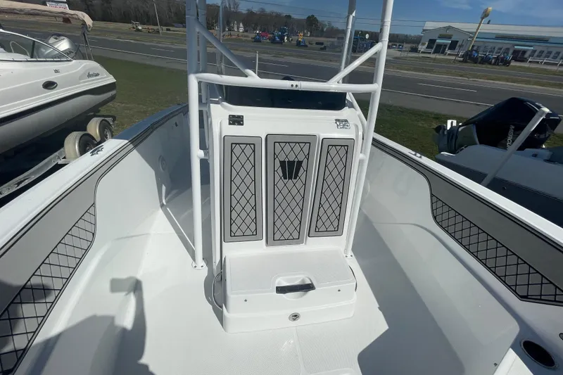 Slide: The Image of 2022 Wellcraft 202 Fisherman boat interior with seating and storage compartments. - 7